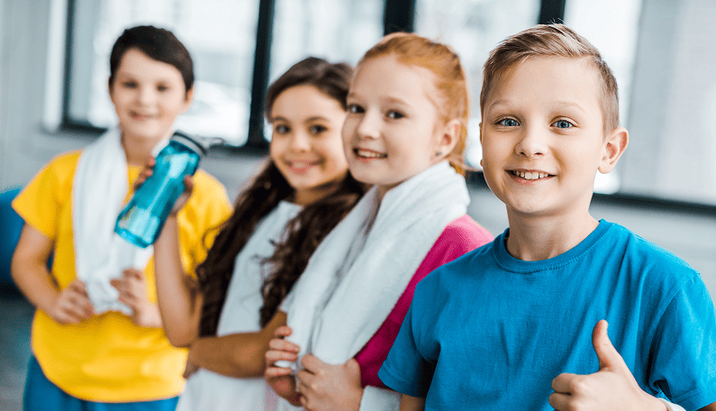 smiling-kids-with-towels-posing-after-training-in-2024-11-17-12-50-13-utc 1